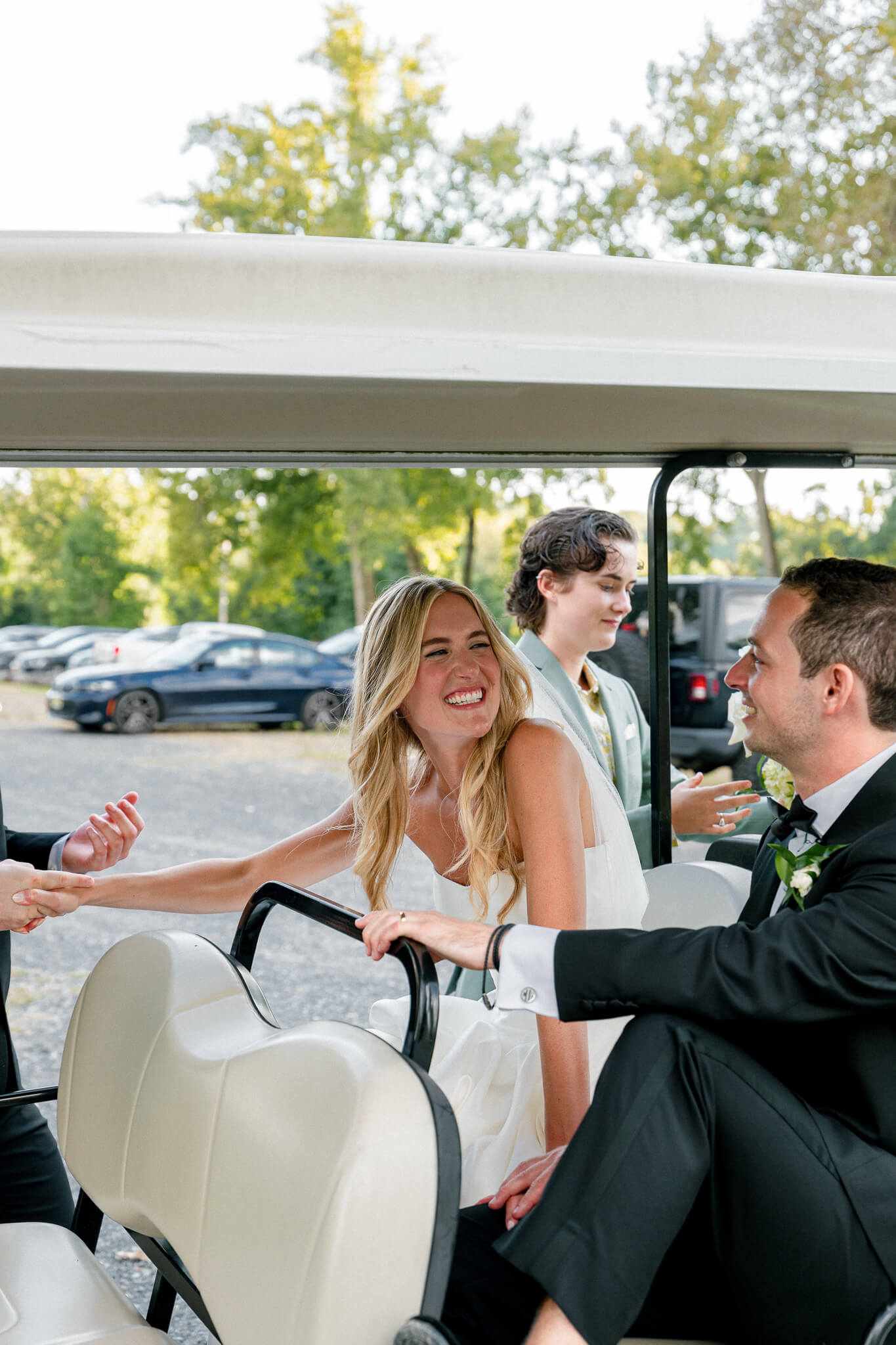 Hutton Brickyards wedding portraits sweet embrace between bride and groom in a golf cart