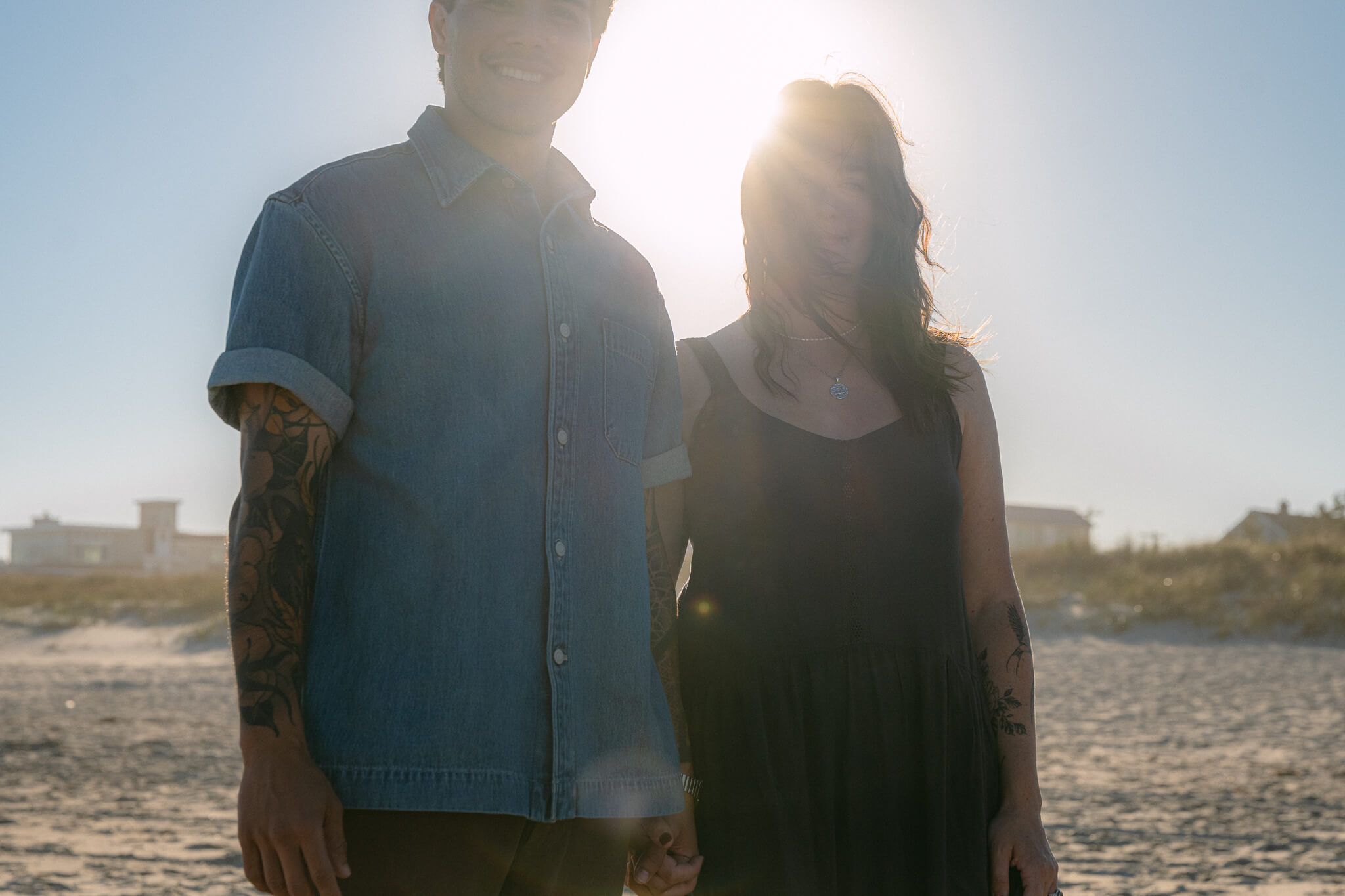 nyc engagement session couple enjoying pizza together and posing for the camera in a fun way in hells kitchen downtown nyc