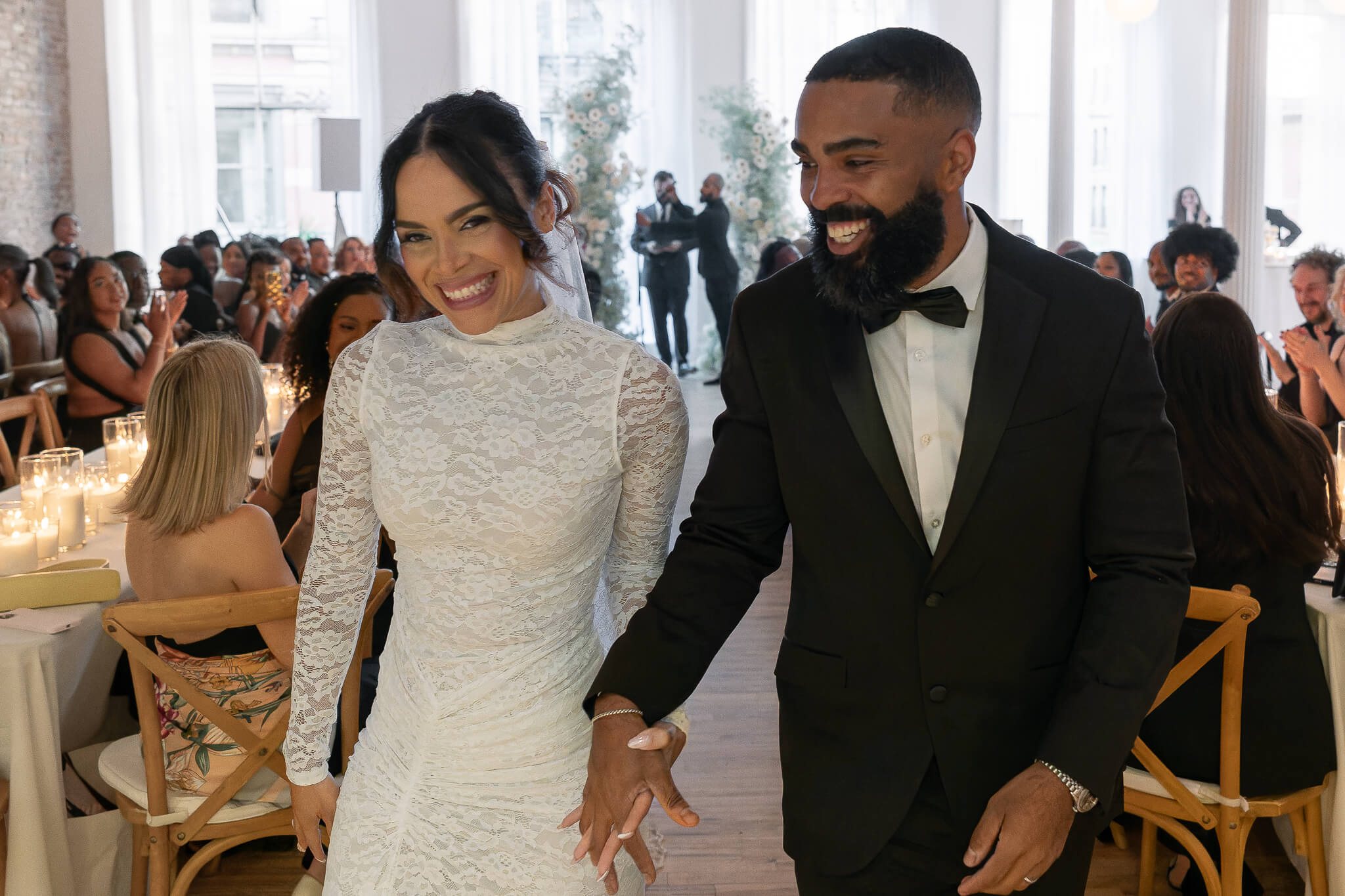  nyc wedding couple walking down aisle after ceremony located in the venue NYC Home Studios