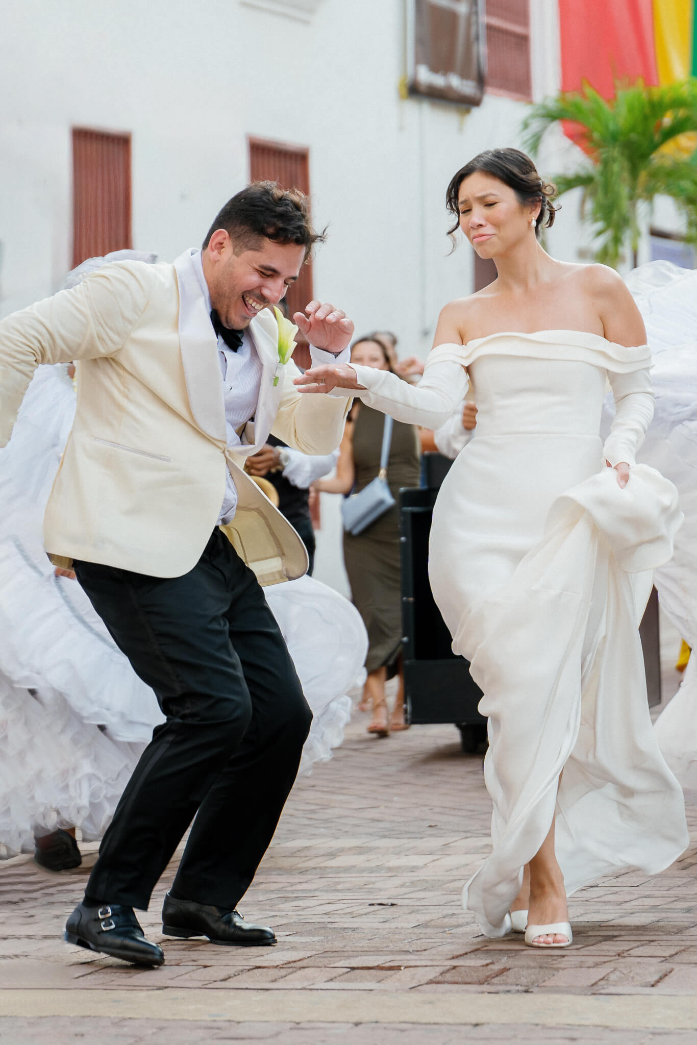Cartagena wedding photography couple dancing after ceremony through the streets of the walled city